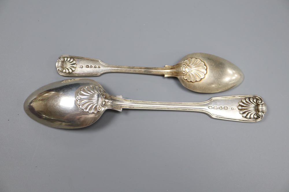 Four Victorian silver fiddle, thread and shell pattern table spoons & 4 dessert spoons.